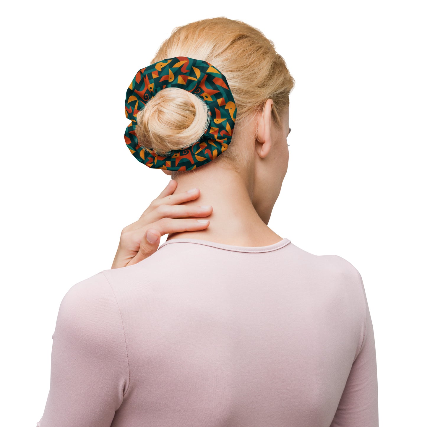 Woman using a colorful heat pack on her neck against a white background