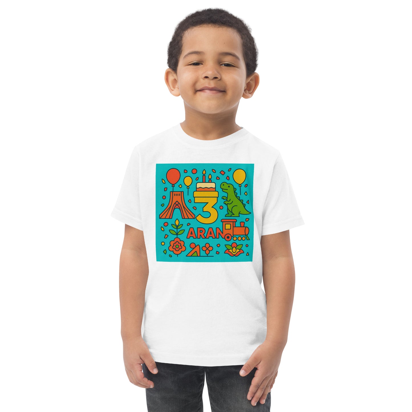 Child wearing a white t-shirt with colorful birthday design on a white background