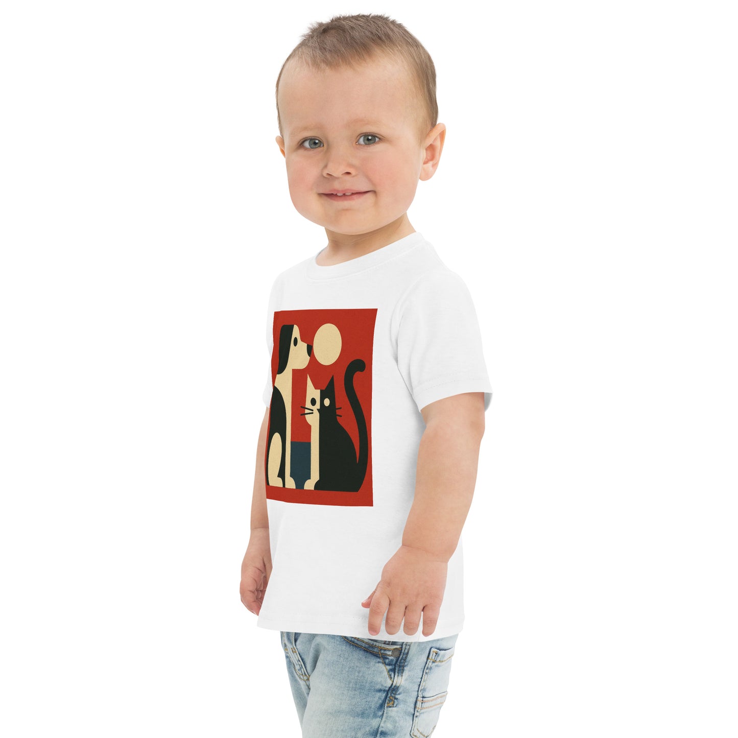 Child wearing a white t-shirt with a graphic design of cats and a moon on a white background