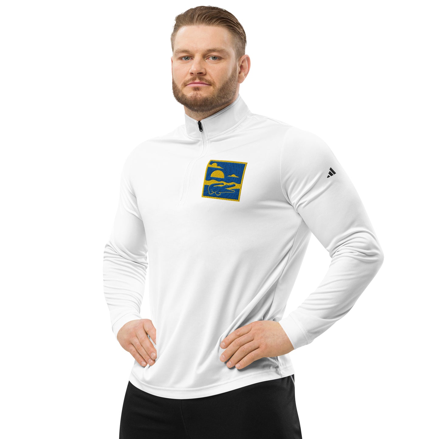 Man wearing a white long-sleeve athletic shirt with a logo on a white background