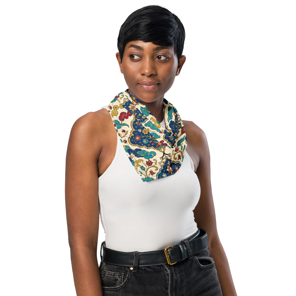 Woman wearing a white tank top and camouflage-patterned scarf on a white background