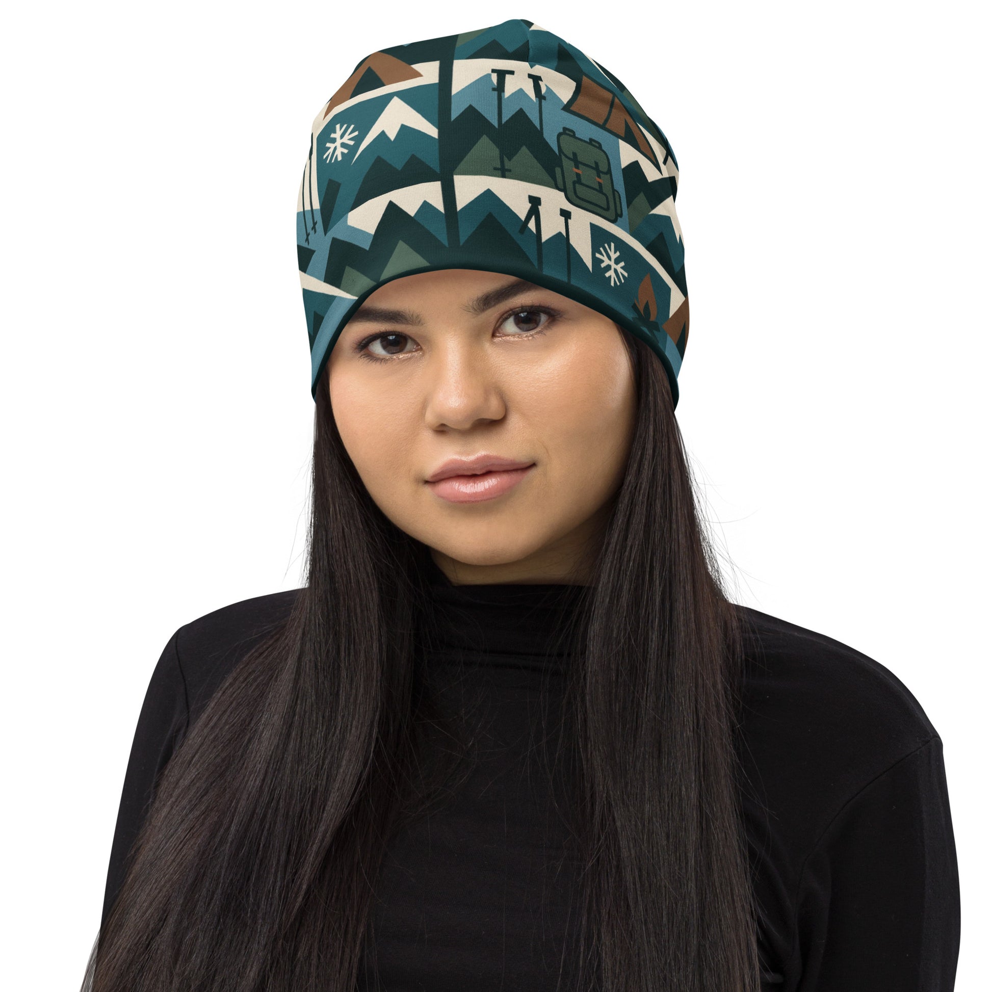 Person wearing a patterned headband with mountains and snowflakes on a white background
