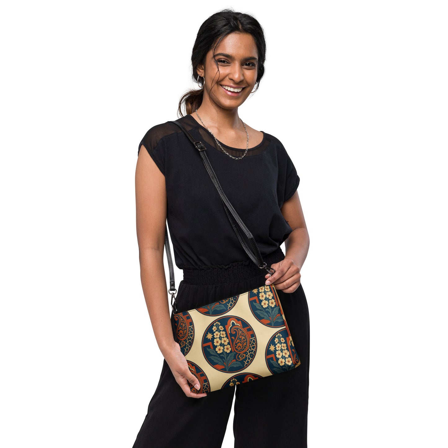 Woman holding a patterned handbag against a white background