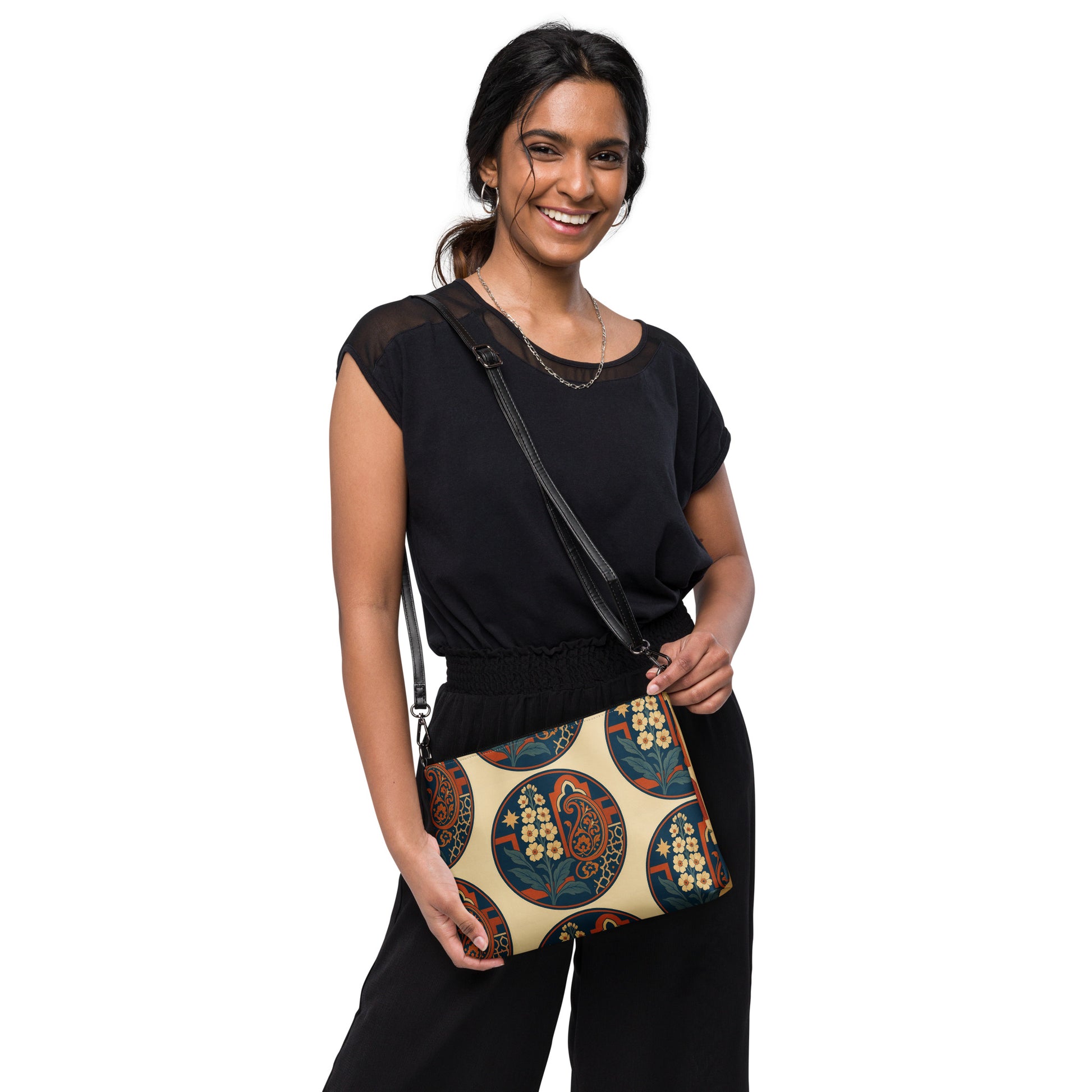 Woman holding a patterned handbag against a white background