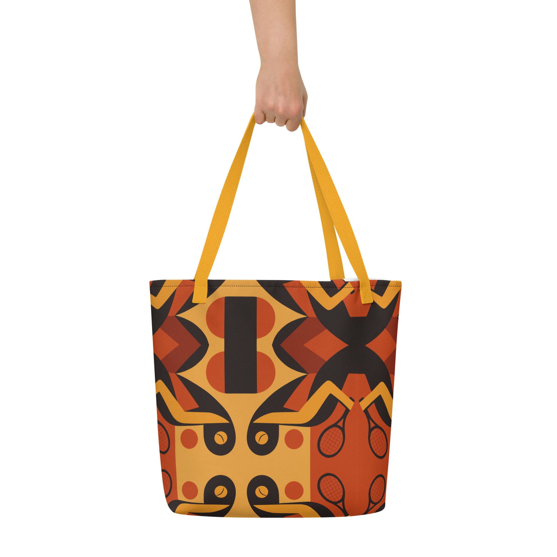 Tote bag with geometric pattern held by a hand on a white background
