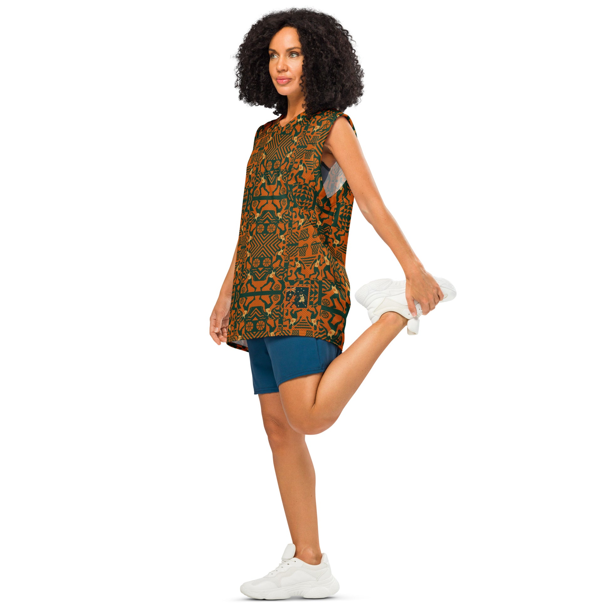 Woman wearing a patterned dress and shorts on a white background