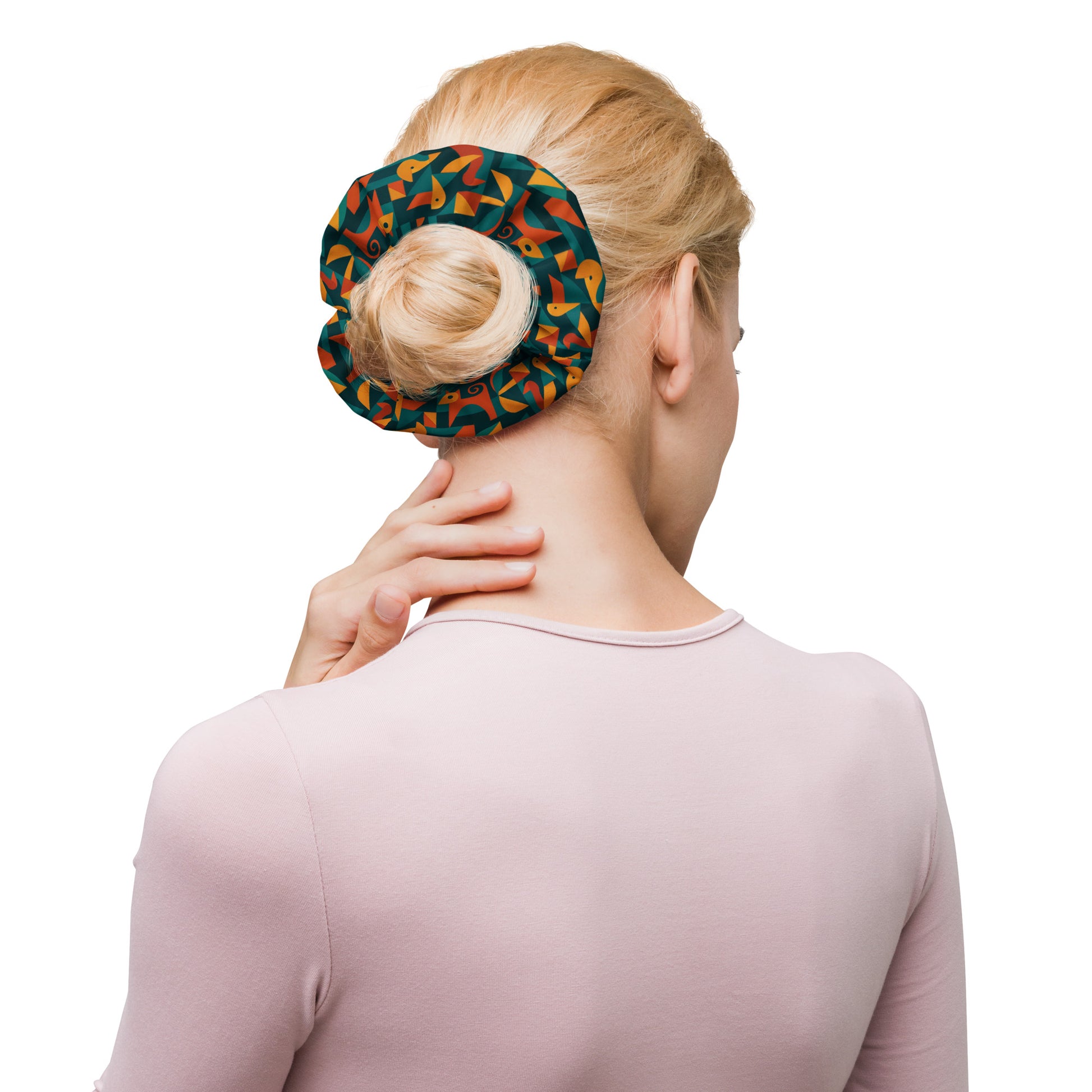 Woman using a colorful heat pack on her neck against a white background