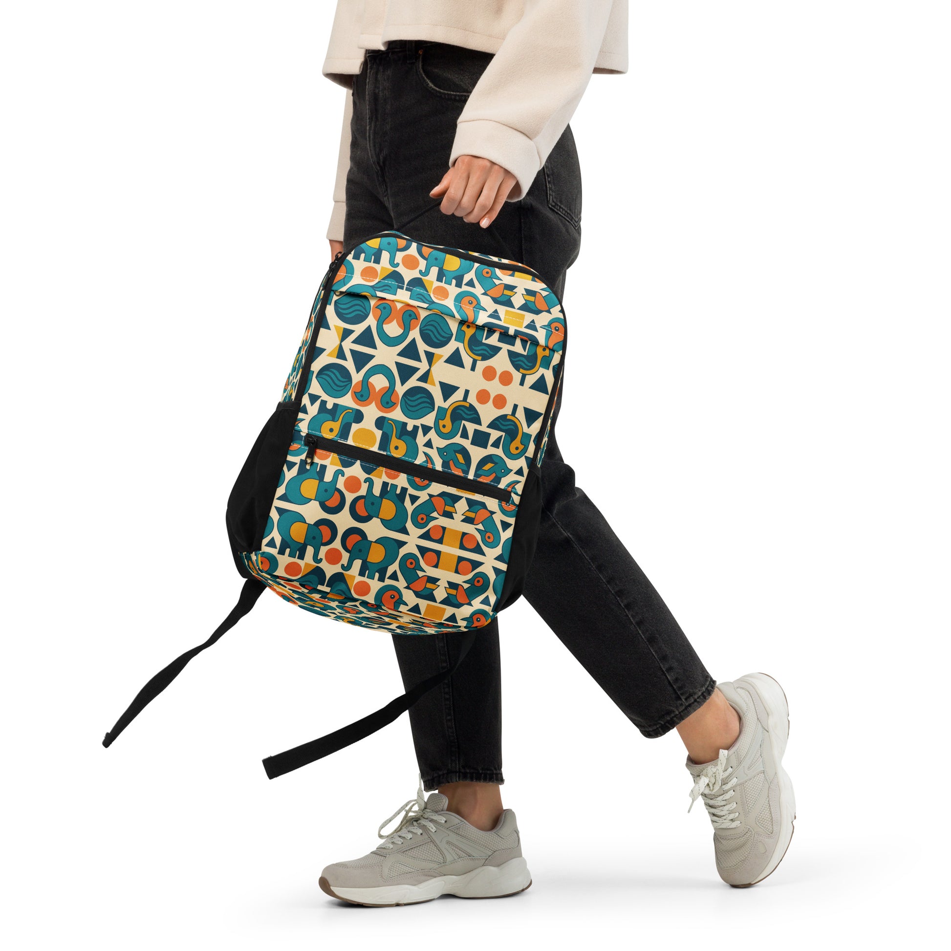 Person wearing a colorful patterned backpack on a white background