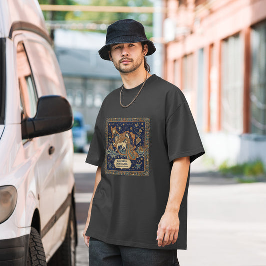 Man wearing a black t-shirt with a graphic design, standing next to a van.
