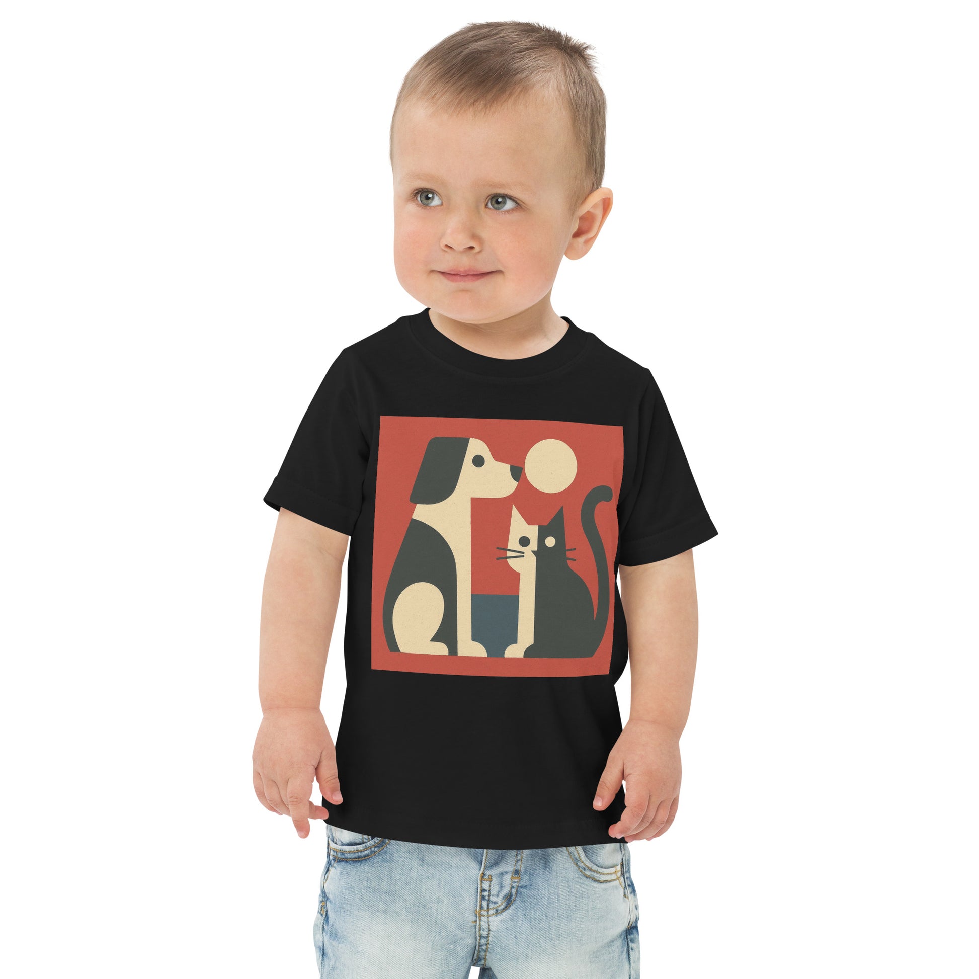 Child wearing a black t-shirt with a graphic of a dog and cat on a white background