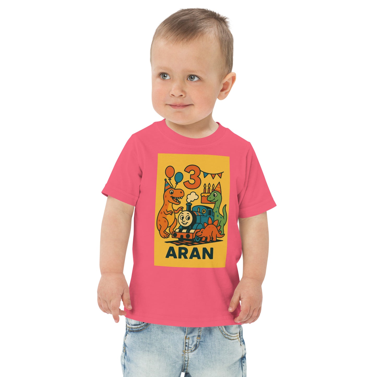 Child wearing a pink t-shirt with a colorful dinosaur design and text on a white background