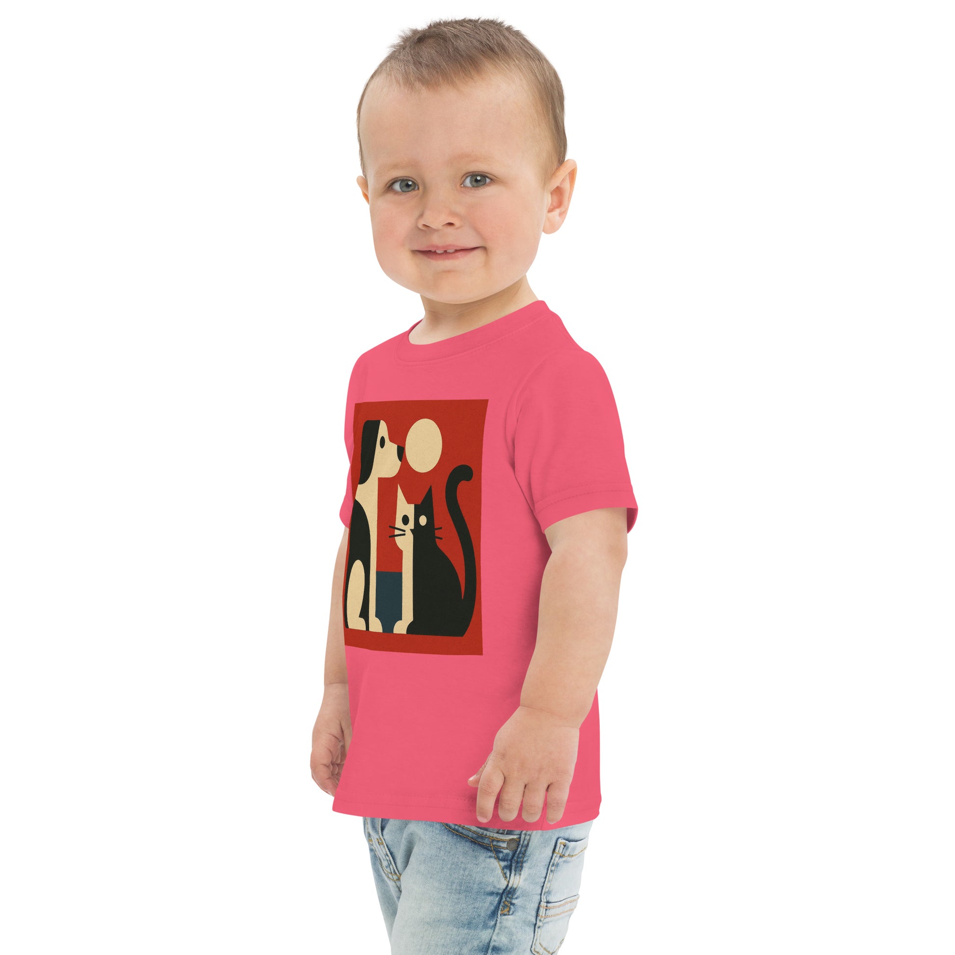 Child wearing a pink t-shirt with a graphic design on a white background