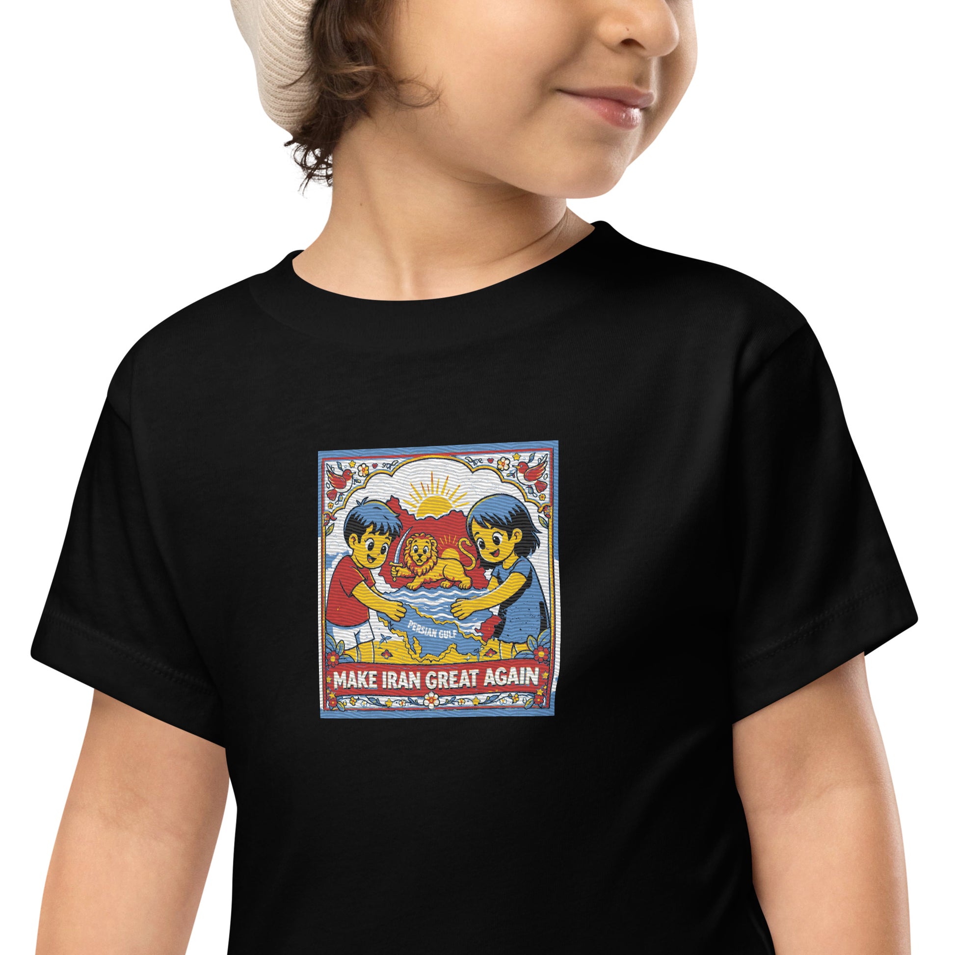 Child wearing a black t-shirt with a colorful graphic and text on a white background
