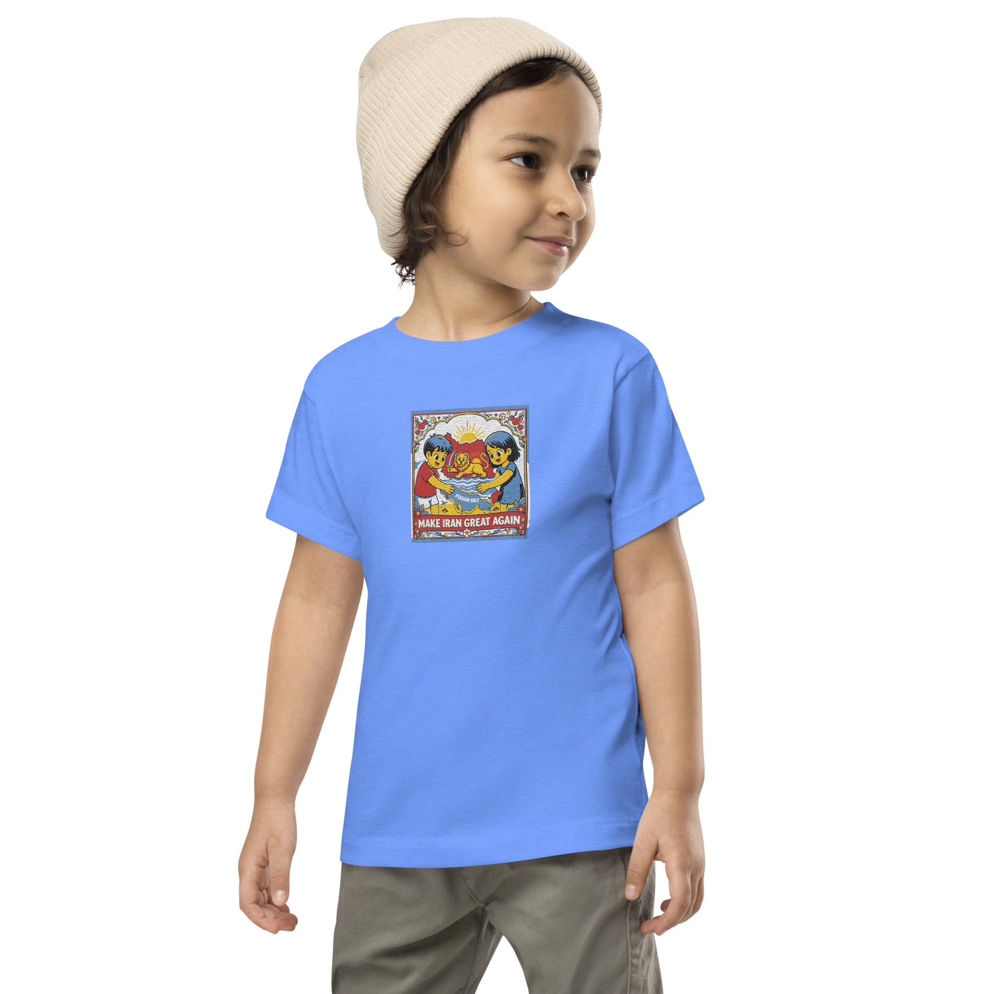 Child wearing a blue t-shirt with a graphic design on a white background