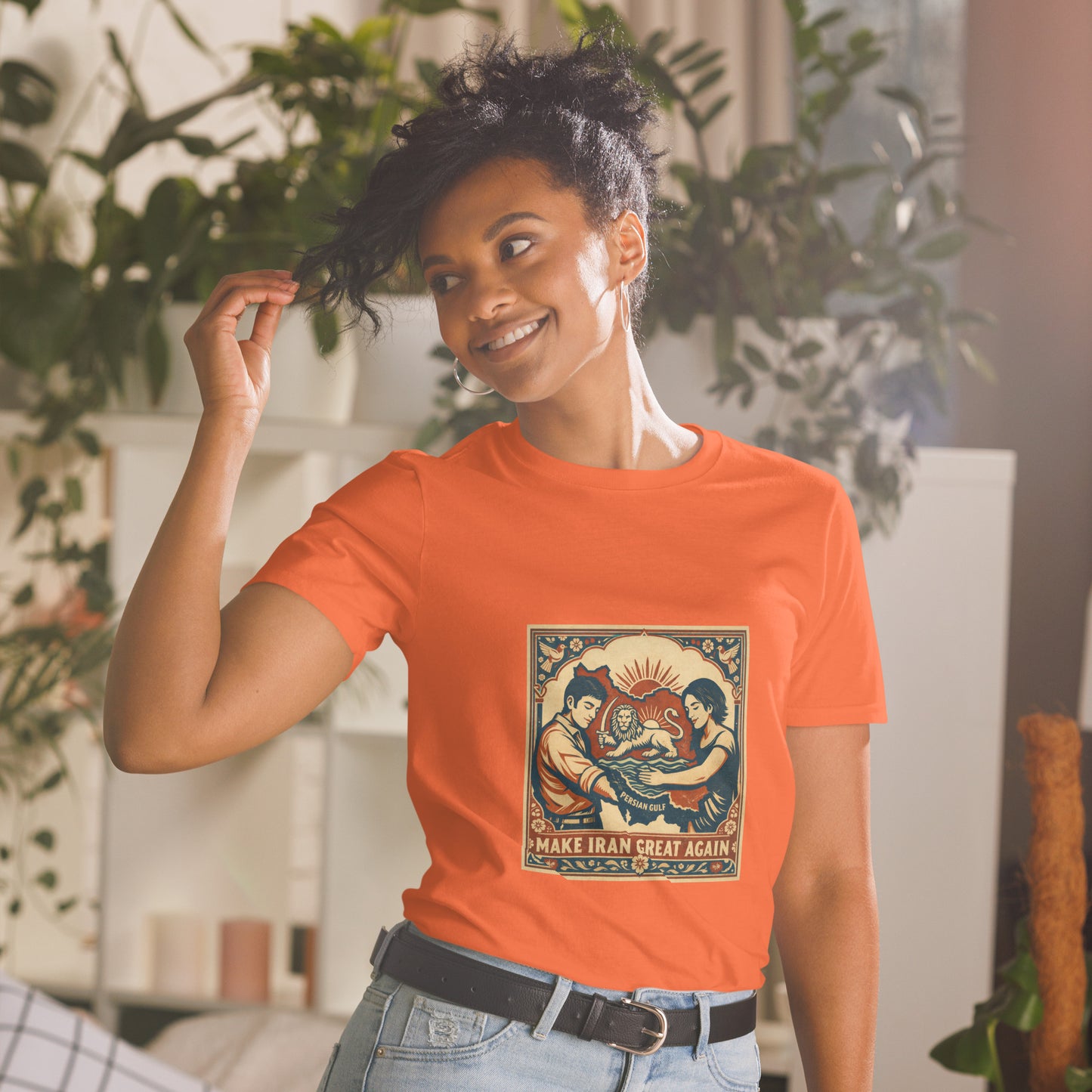 Person wearing an orange t-shirt with a graphic design in a casual setting