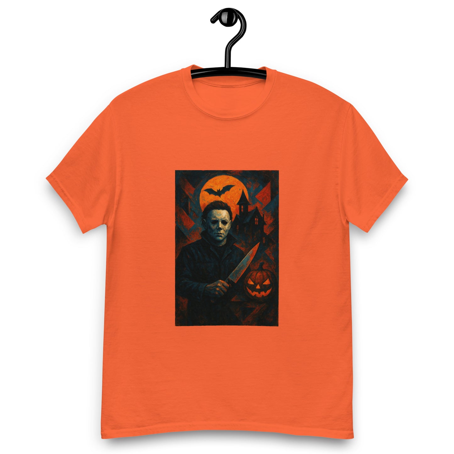 Orange t-shirt with a graphic design of a character holding a knife and a pumpkin, on a hanger against a white background.