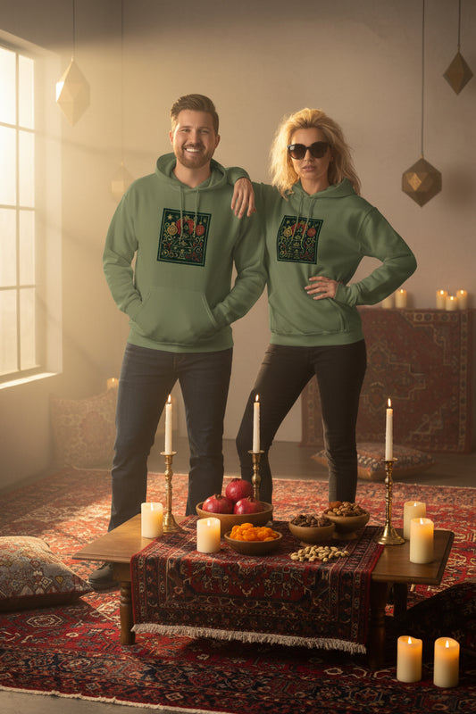 Two people wearing green hoodies with a colorful design yalda night 