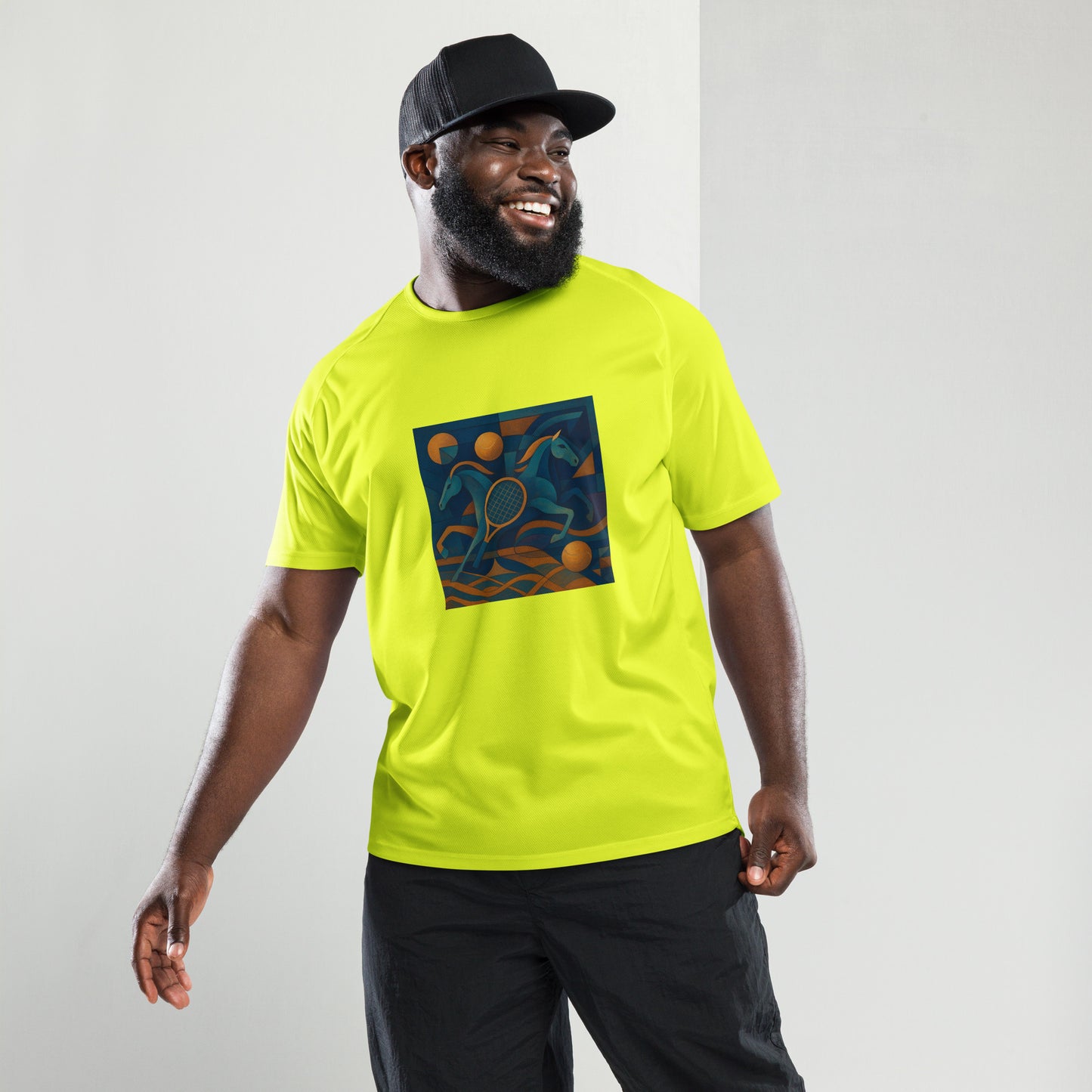 Man wearing a bright yellow t-shirt with a colorful graphic design on a plain background