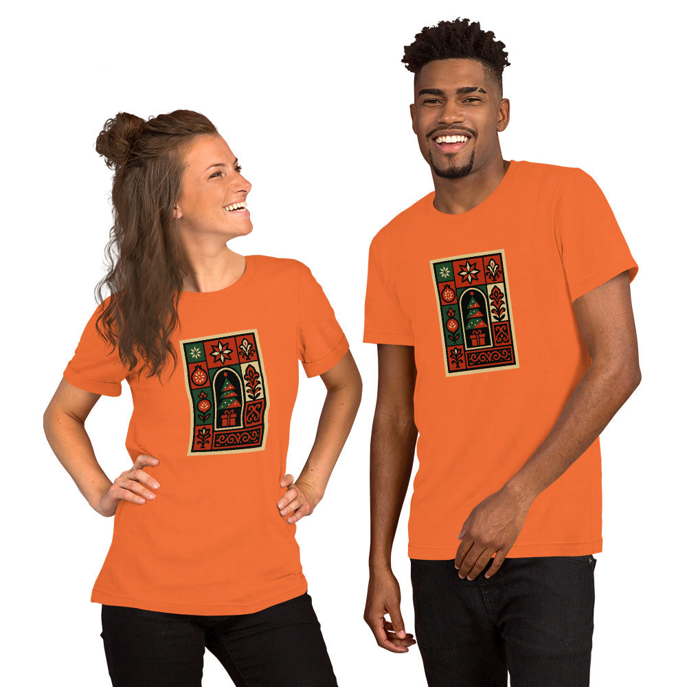 Two people wearing orange t-shirts with a decorative design on CHRISTMASS