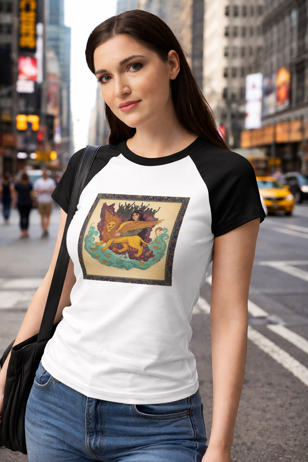 Woman wearing a white and black baseball shirt with a graphic design on a city street.